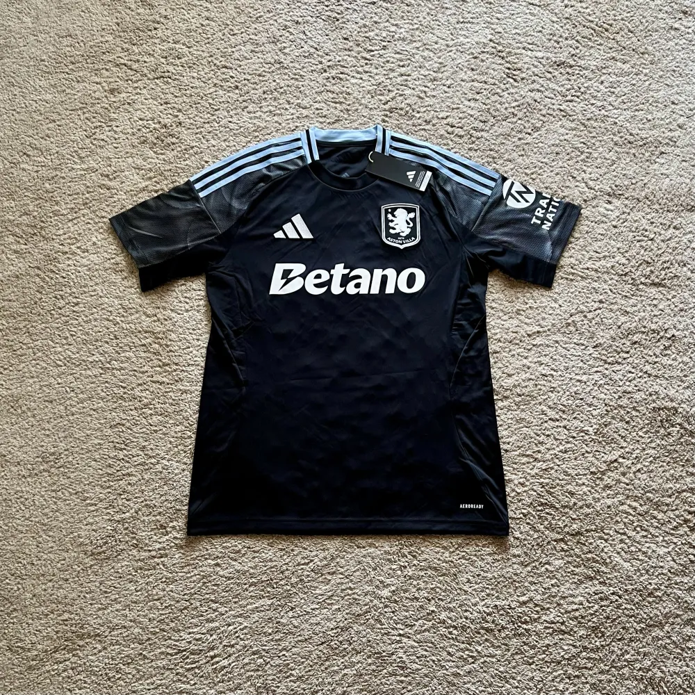 Front view of Aston Villa 2025/26 Adidas Away Shirt (Betano) - Men's Medium