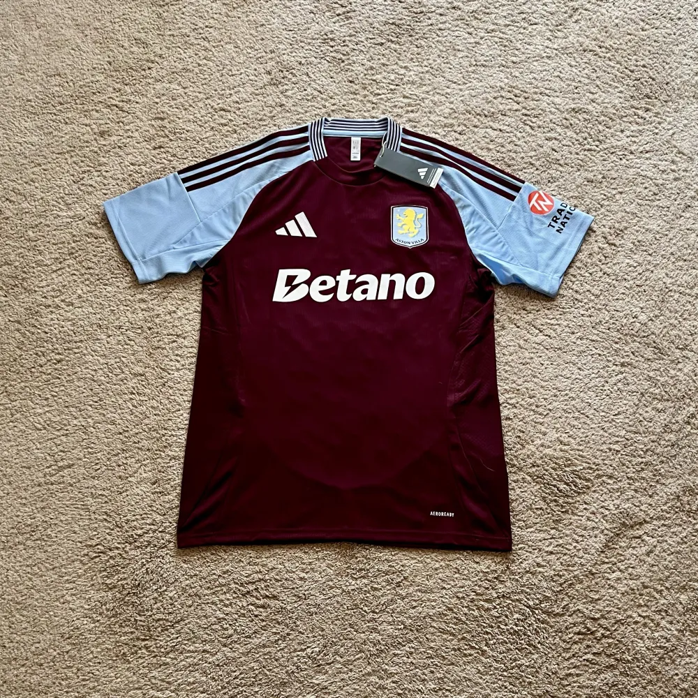 Front view of Aston Villa 2024/25 Adidas Home Shirt (Betano) - Men's Medium