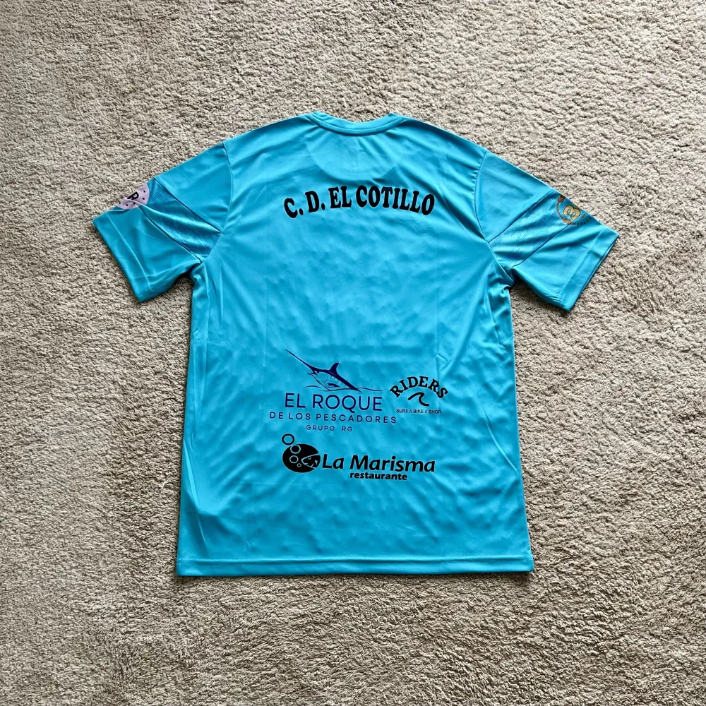 Rear view of CD El Cotillo 2024-26 Joma Home Shirt (La Oliva) - Men's Medium